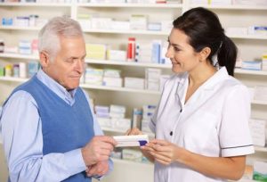 Photo of a man picking up his prescriptions at Jacobson Pharmacy in Yonkers, New York