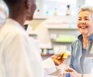 A photo of a customer receiving personalized  service at the counter of Jacobson Pharmacy in Yonkers, New York